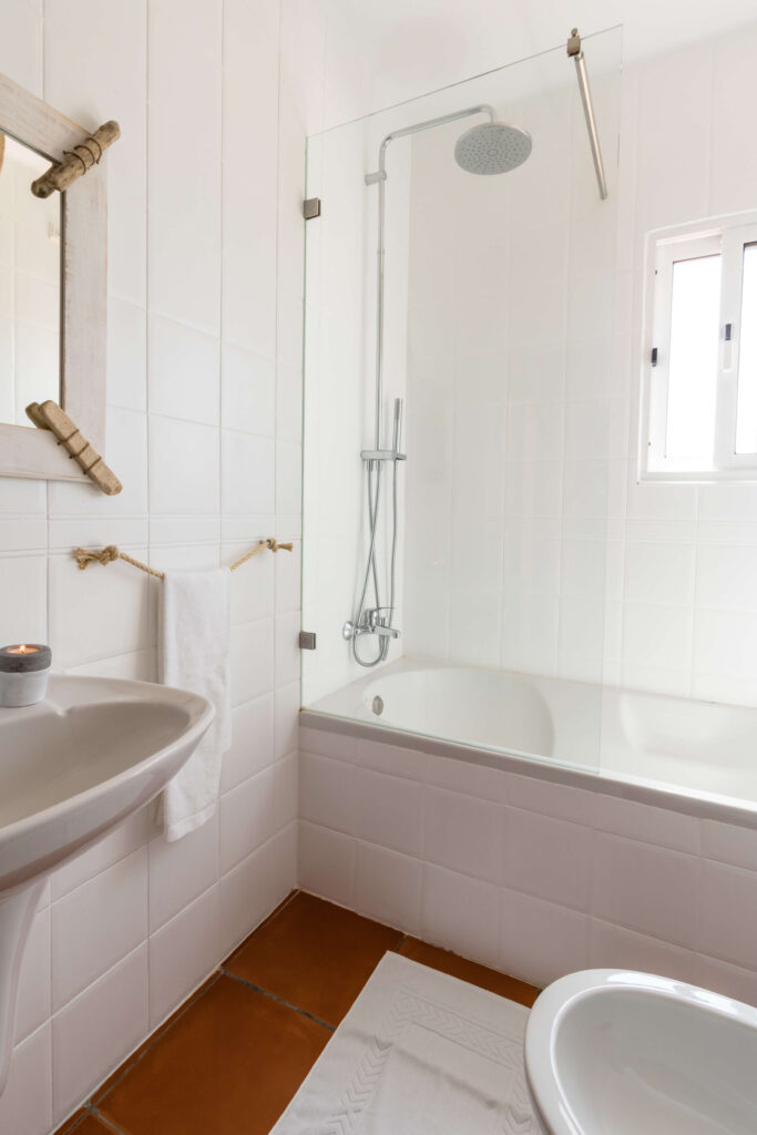 ensuite bathroom with clean and simple decor