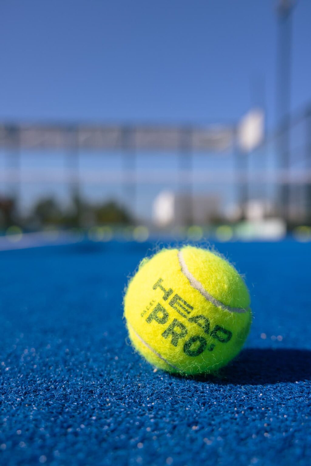 A tennis ball in the SW padel court outside of utopia hotel