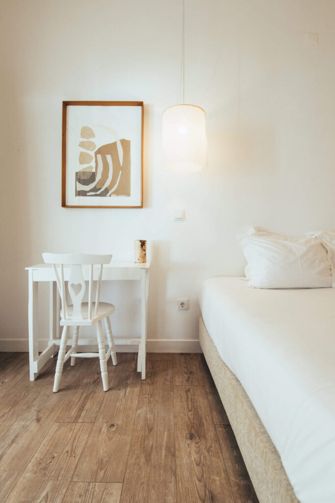 A terrace room at utopia hotel that includes a desk and a double bed