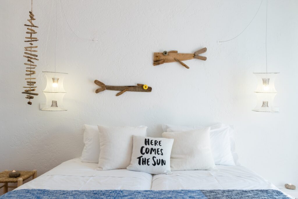 twin beds in a private ensuite balcony room with beach inspired decor